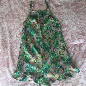 LF romper with floral pattern in pastel colors.